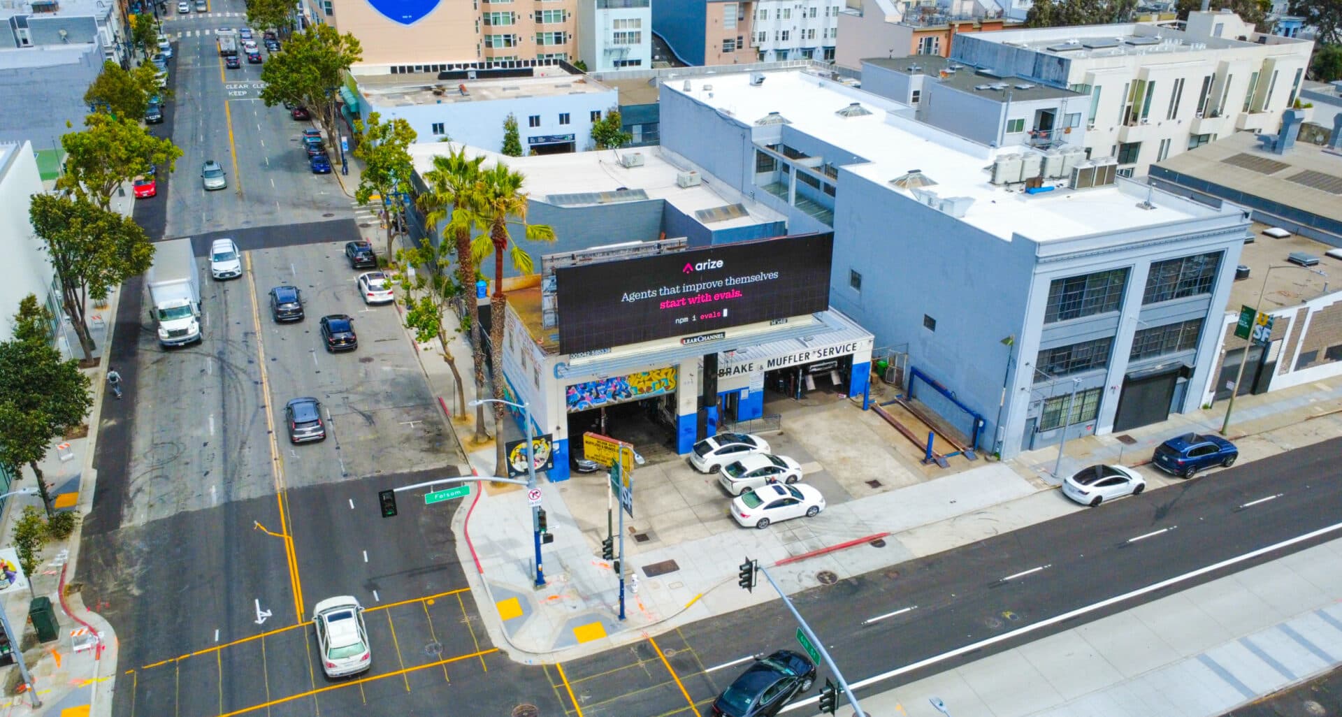 Aerial view of the SoMa automotive facility at 998 Folsom Street in San Francisco, a corner auto repair shop with service bays and frontage parking