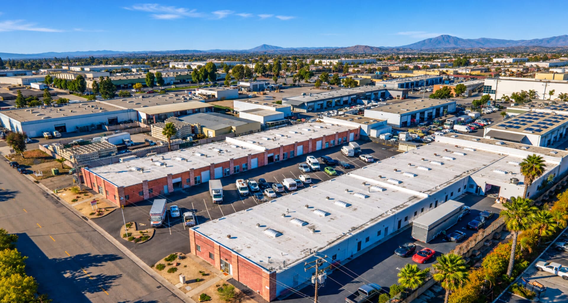 Aerial view of Brickyard Industrial Park, a San Diego industrial business park with multi-tenant brick and white-roofed buildings